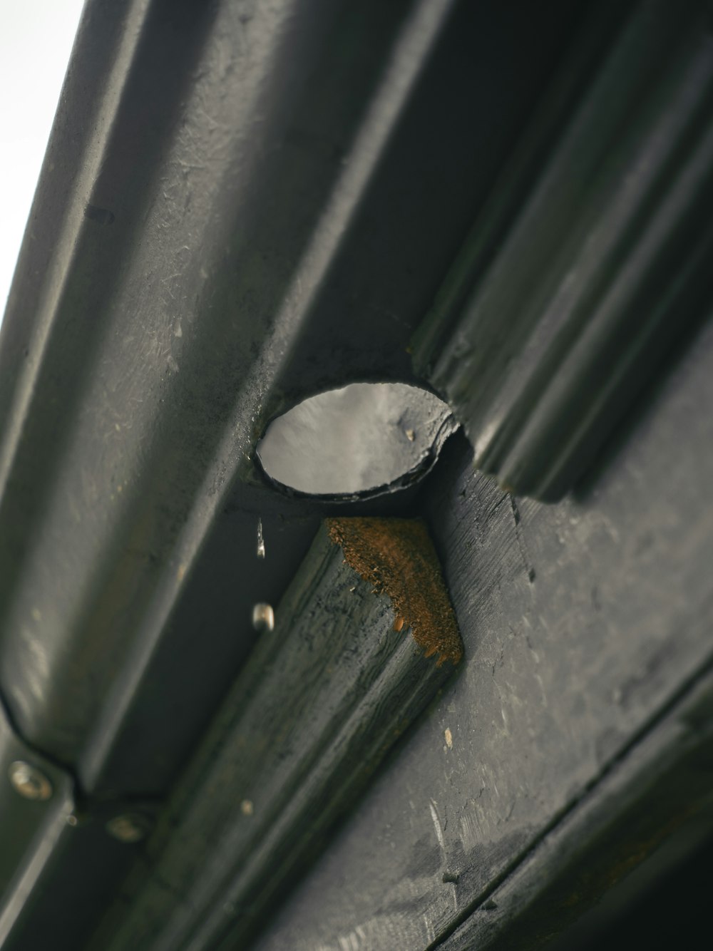 a close up of a metal object on a building