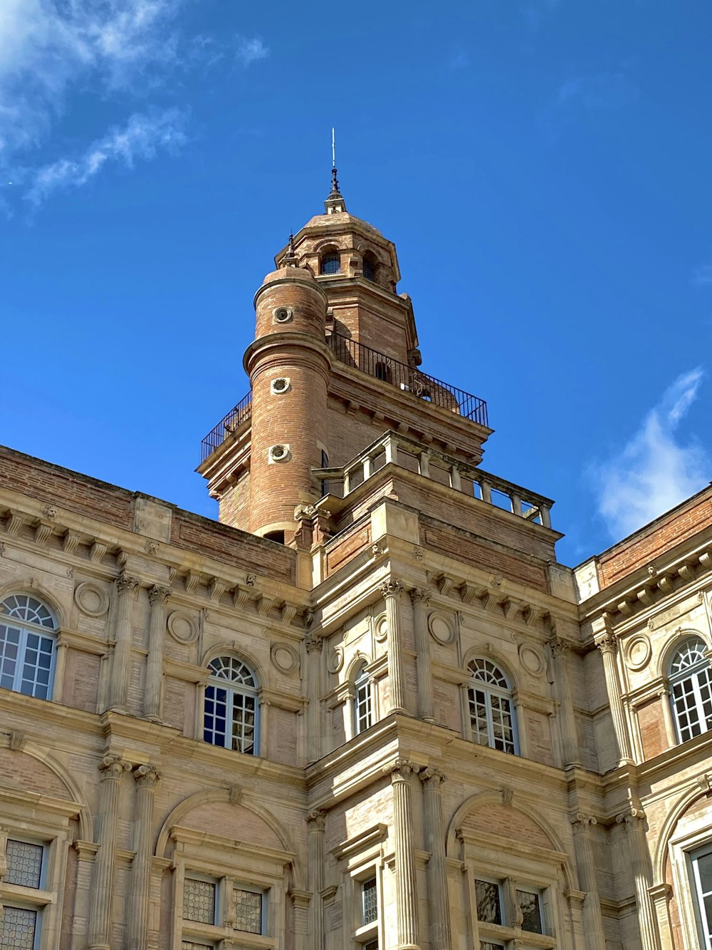 a tall building with a clock on the top of it