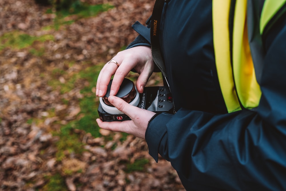 a person holding a camera in their hand