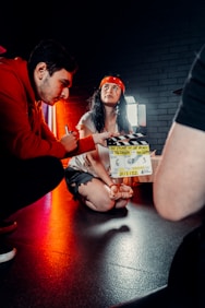 a man and a woman sitting on a table