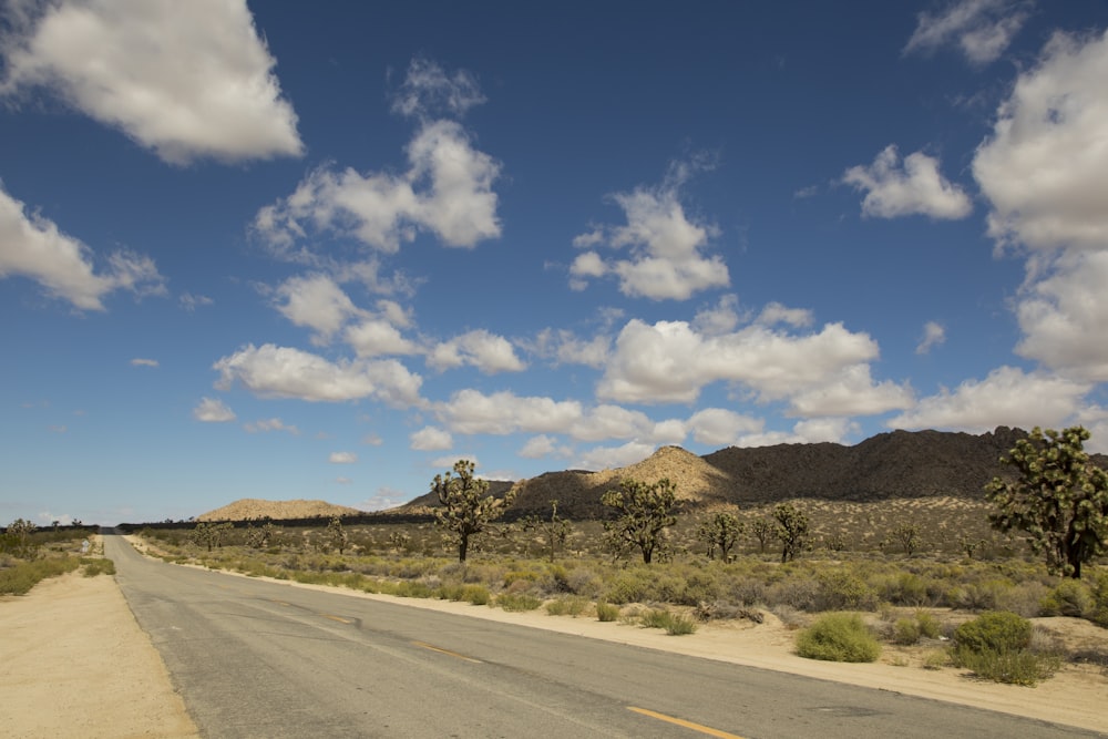 a deserted road in the middle of a desert