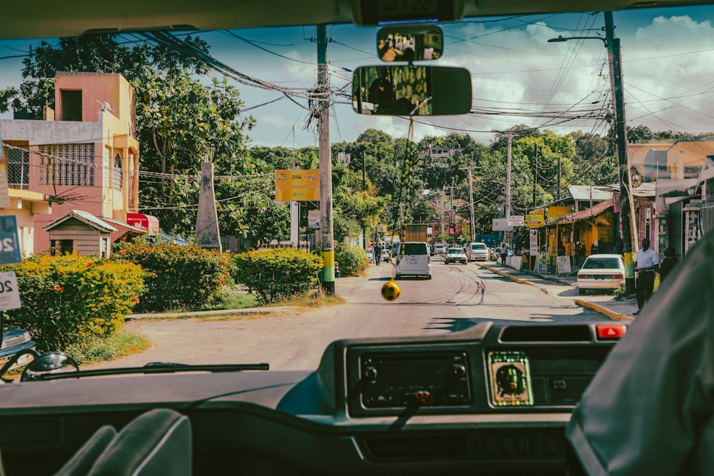 a view of a street from inside a vehicle