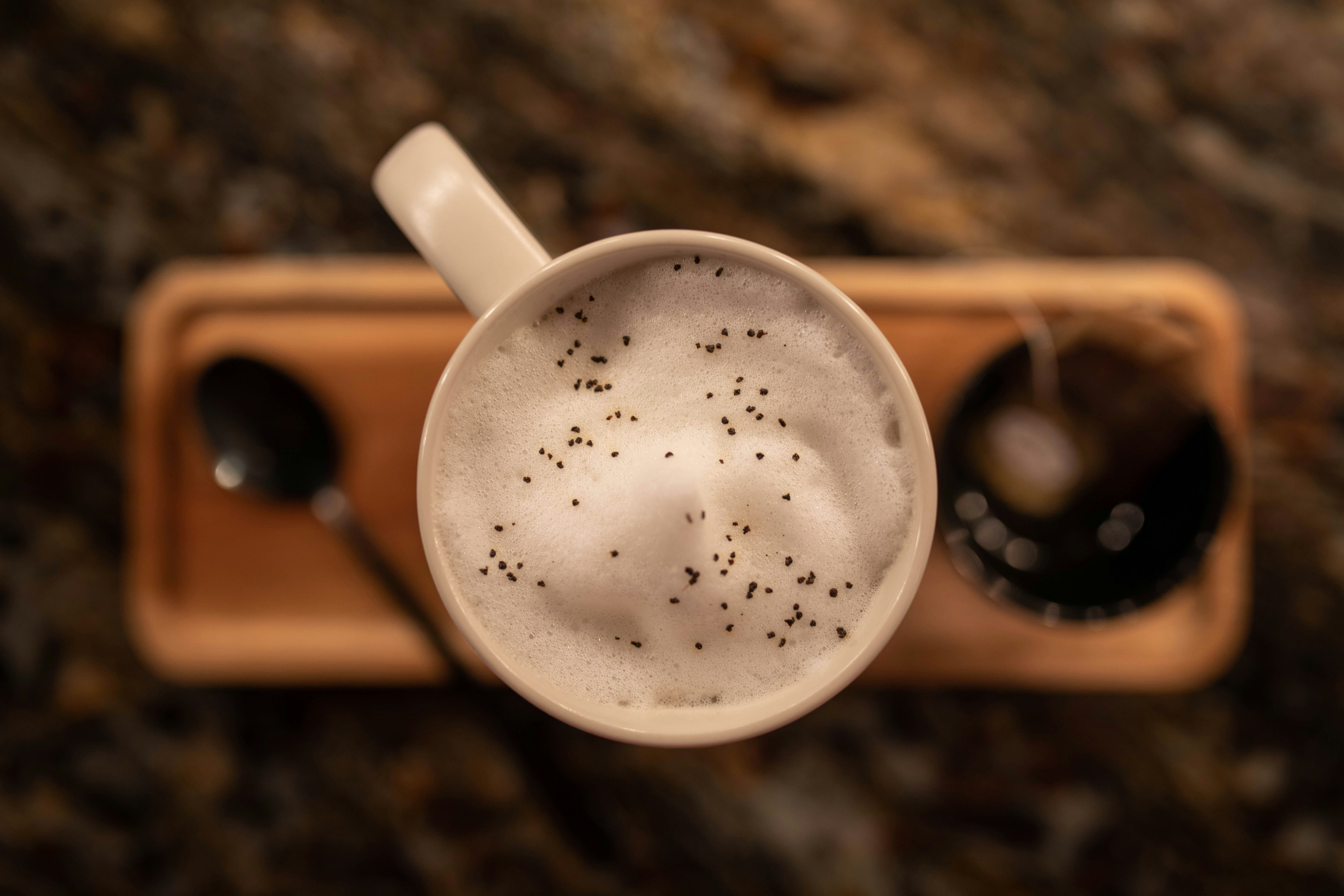 a close up of a cup of coffee on a table