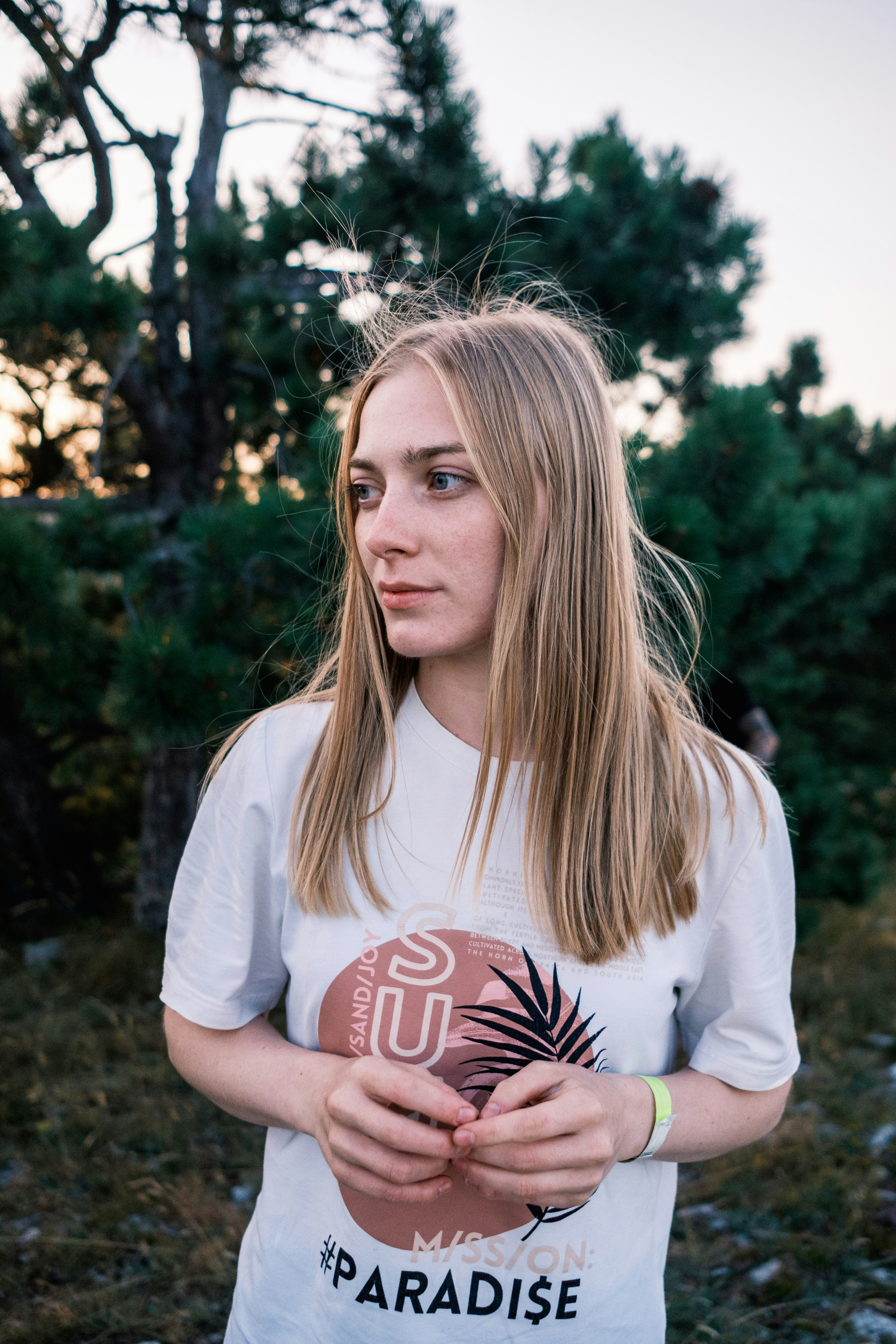 a young woman holding a football in her hands