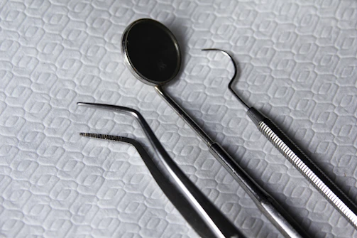 A set of dental handpieces arranged neatly, showcasing variety and precision