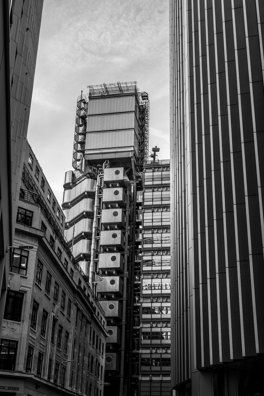 a black and white photo of tall buildings