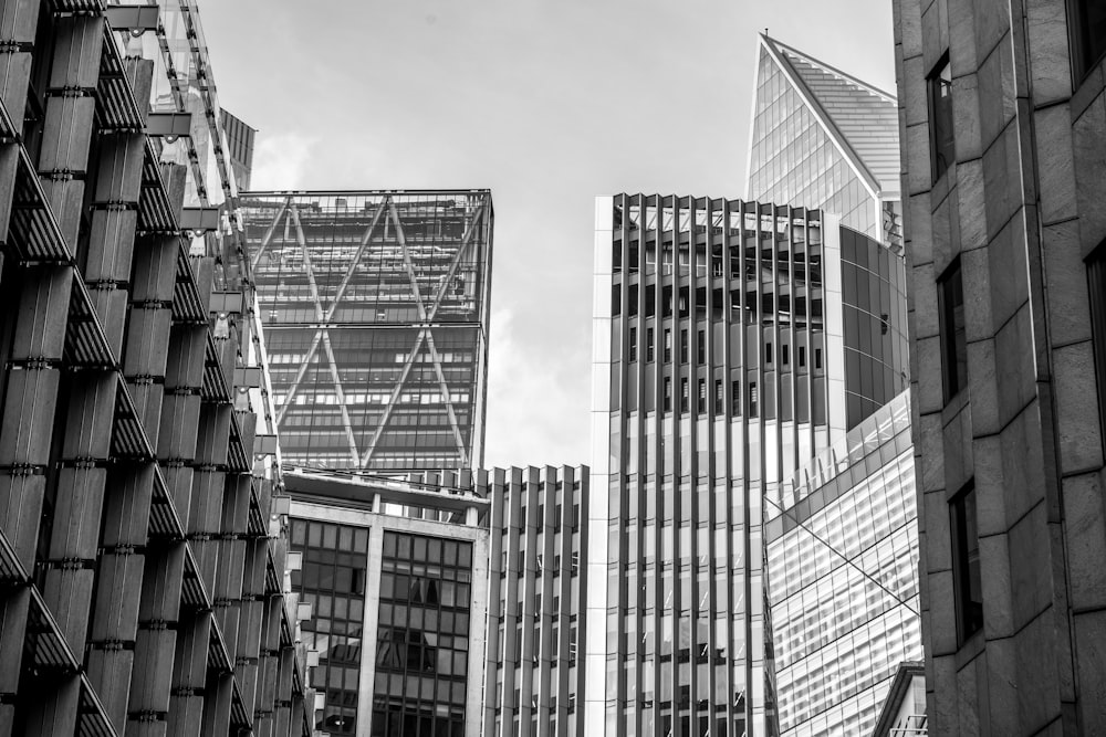 a black and white photo of some very tall buildings