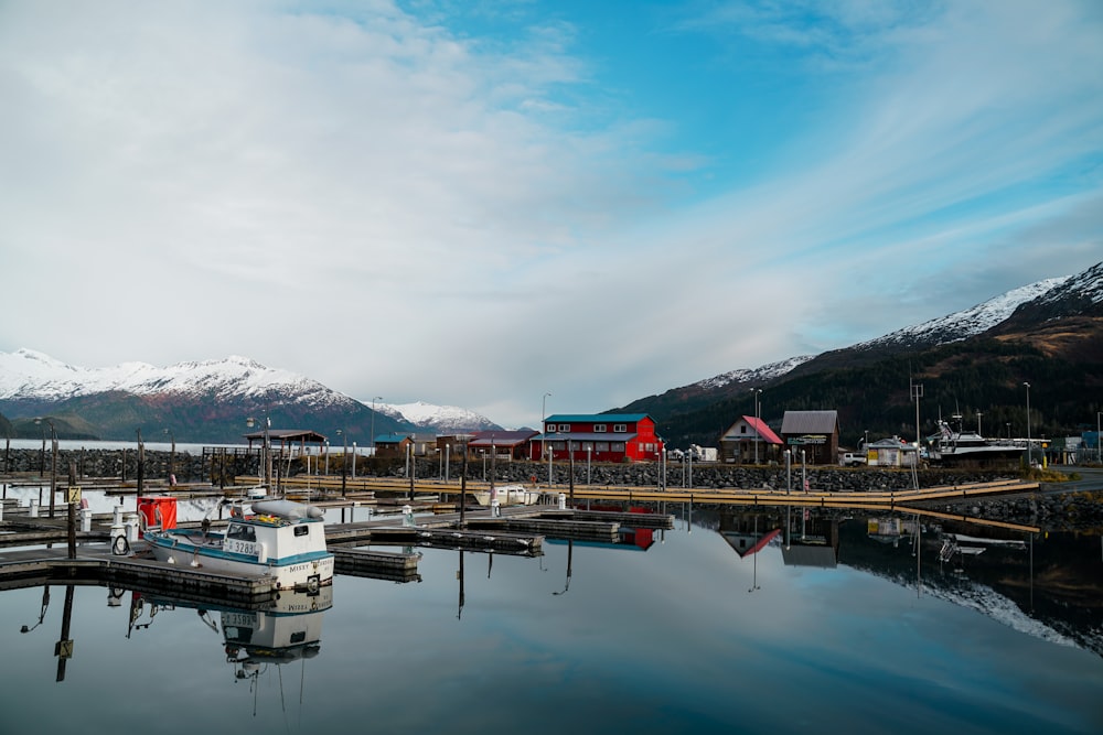 a boat is docked at a dock in the water