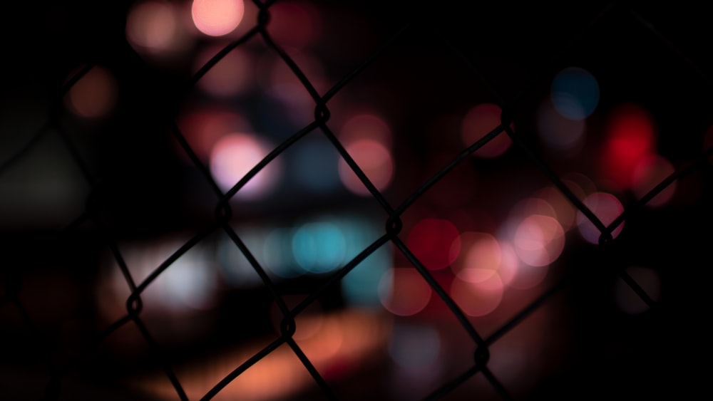 a blurry photo of a chain link fence