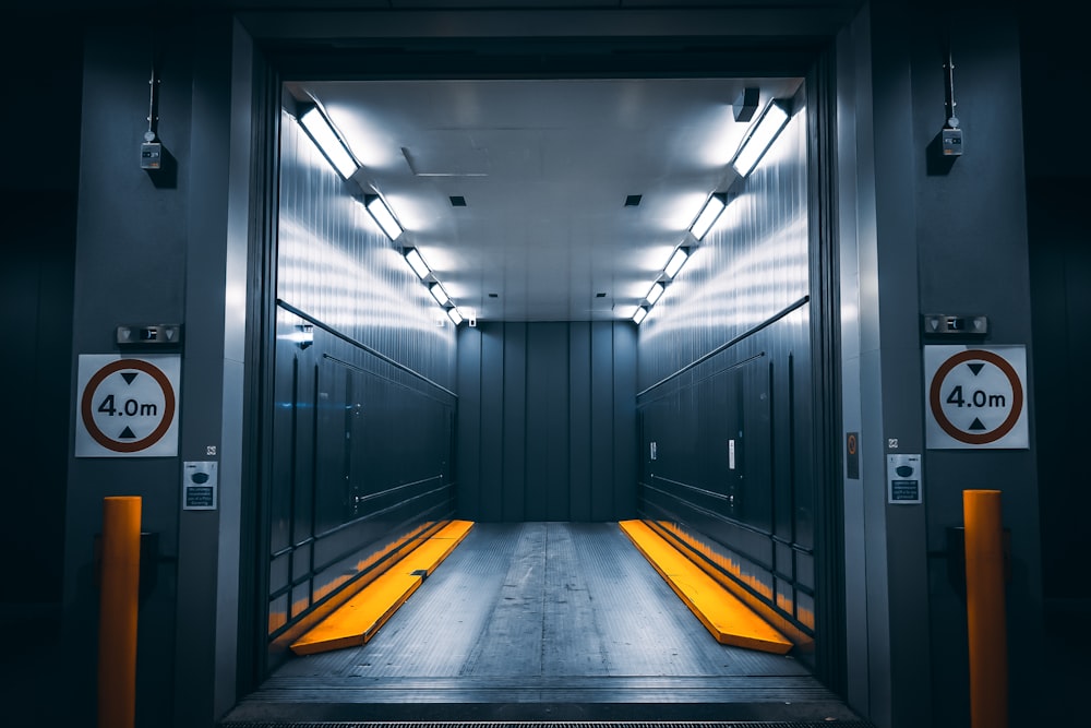 a very long hallway with a lot of yellow lights