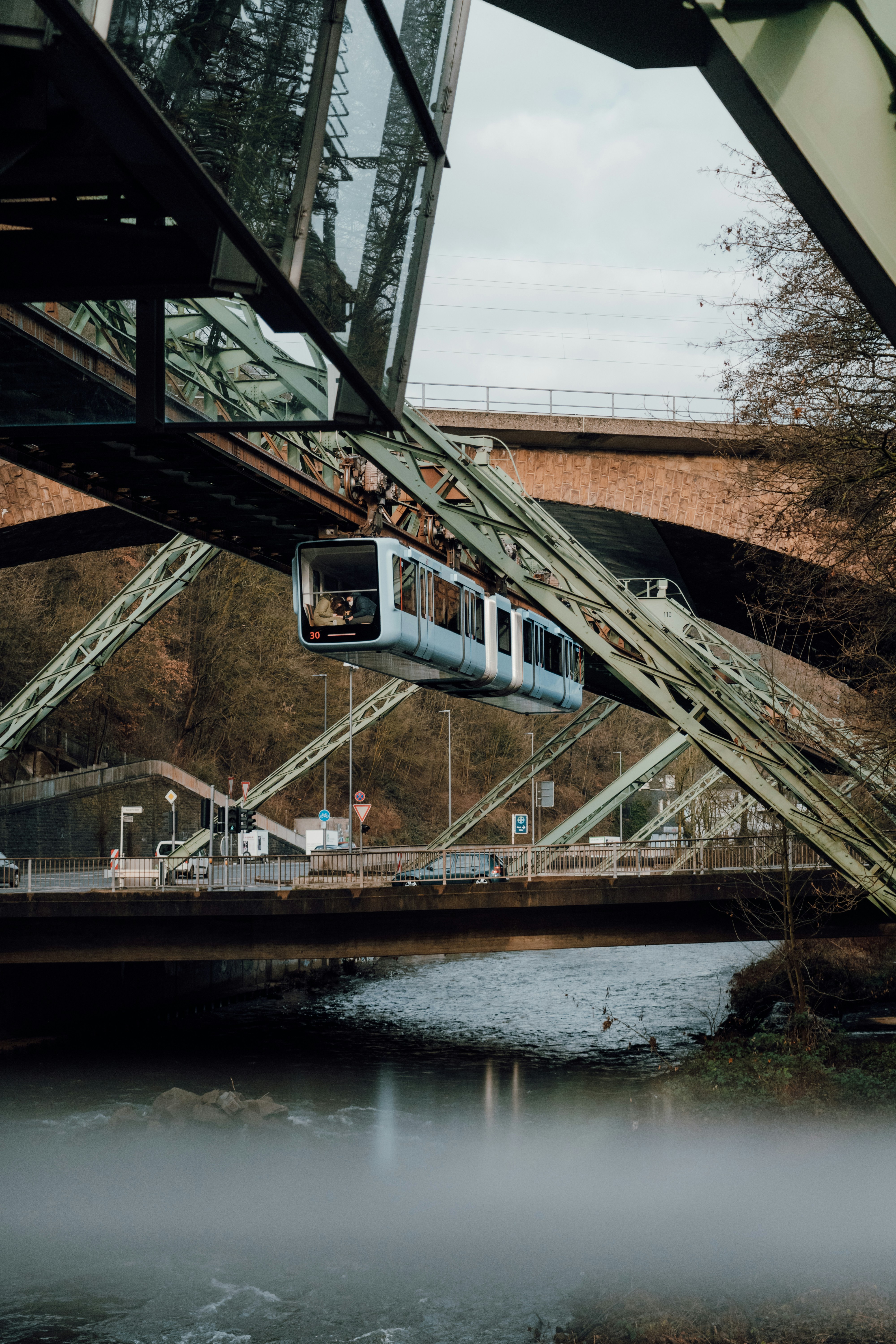 a train traveling over a bridge over a river