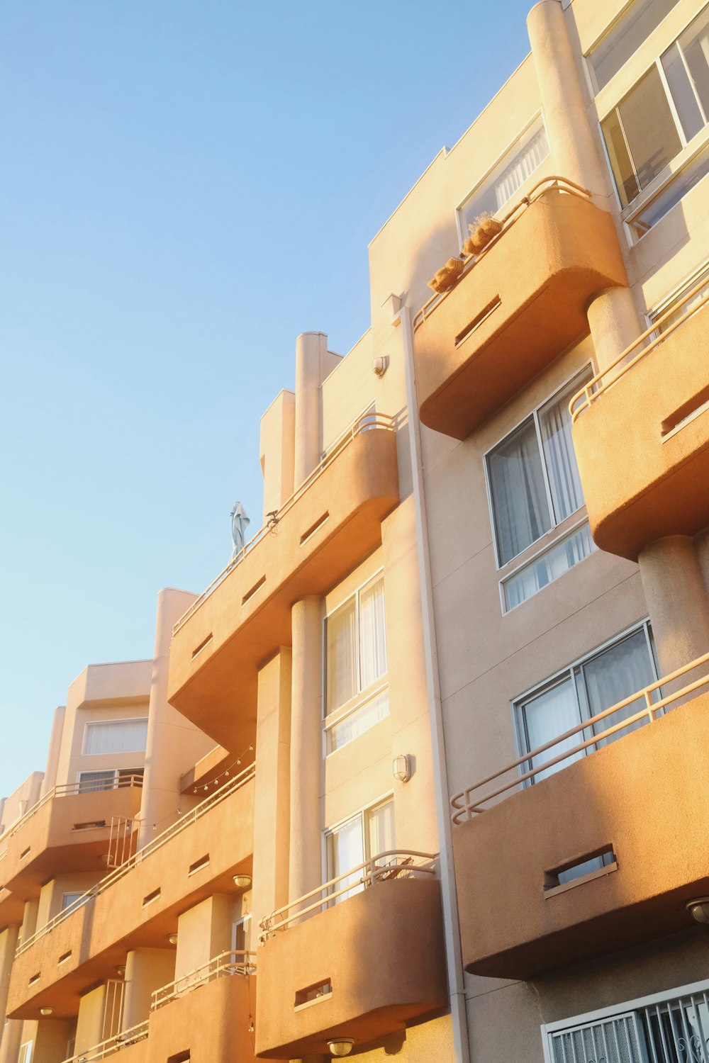 an apartment building with balconies and balconies on the balconies