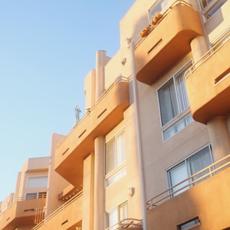 an apartment building with balconies and balconies on the balconies