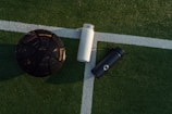 a soccer ball and a water bottle on a soccer field