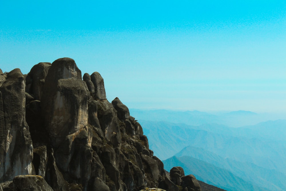 a group of people standing on top of a mountain