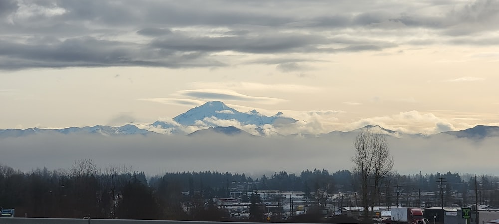 a view of a snow covered mountain in the distance