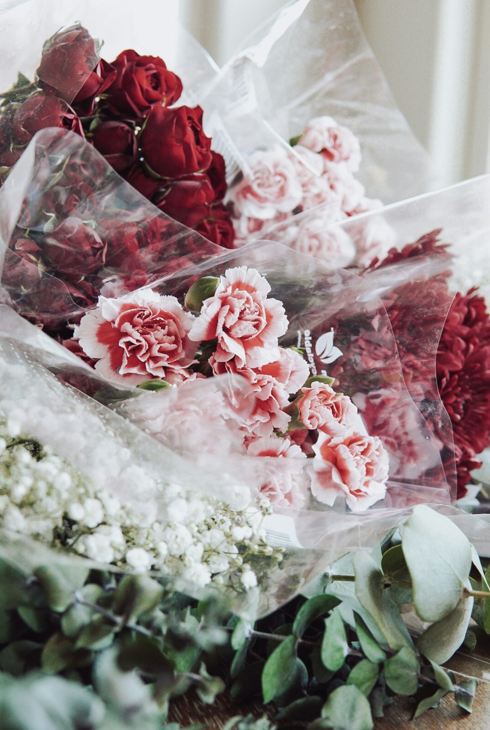 a bunch of flowers sitting on top of a table