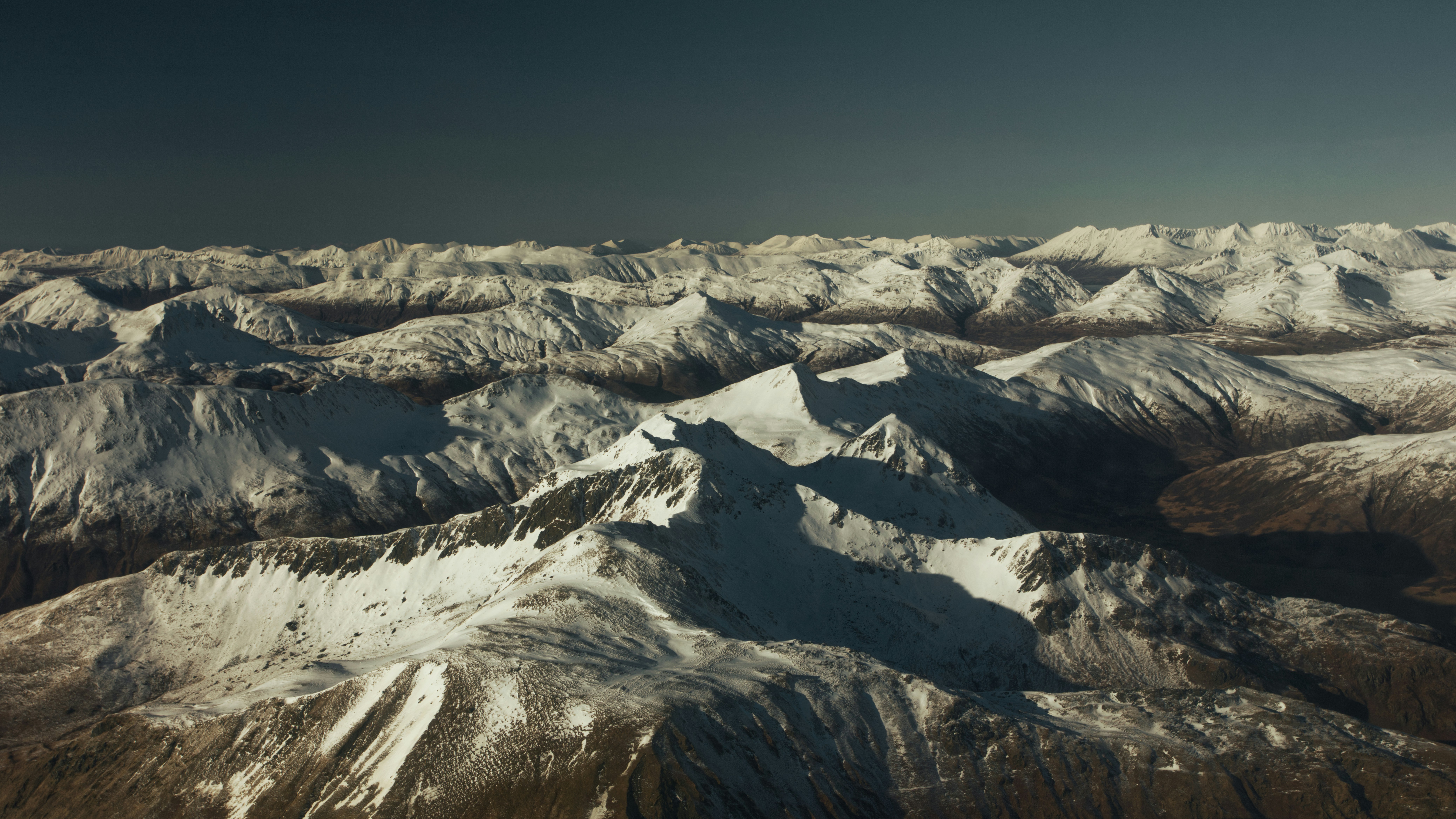 a view of a mountain range from an airplane