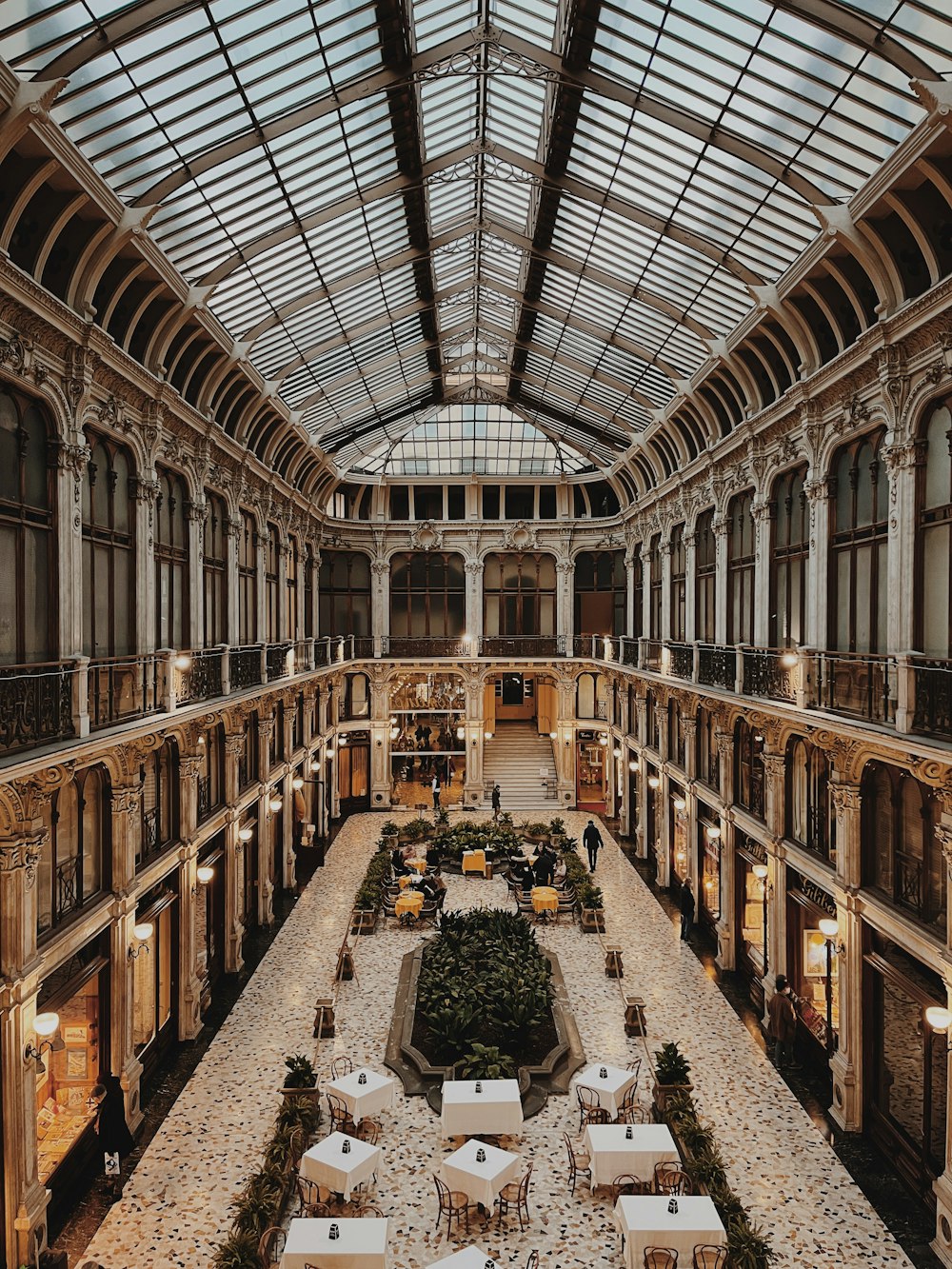 a large building with tables and chairs inside of it