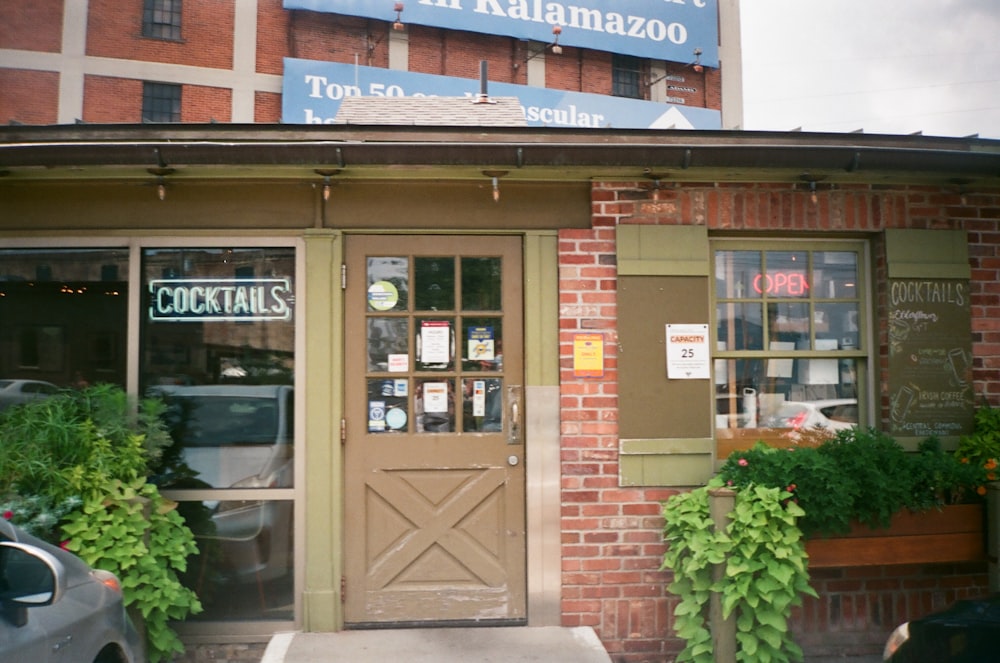 the front of a restaurant with a sign above the door