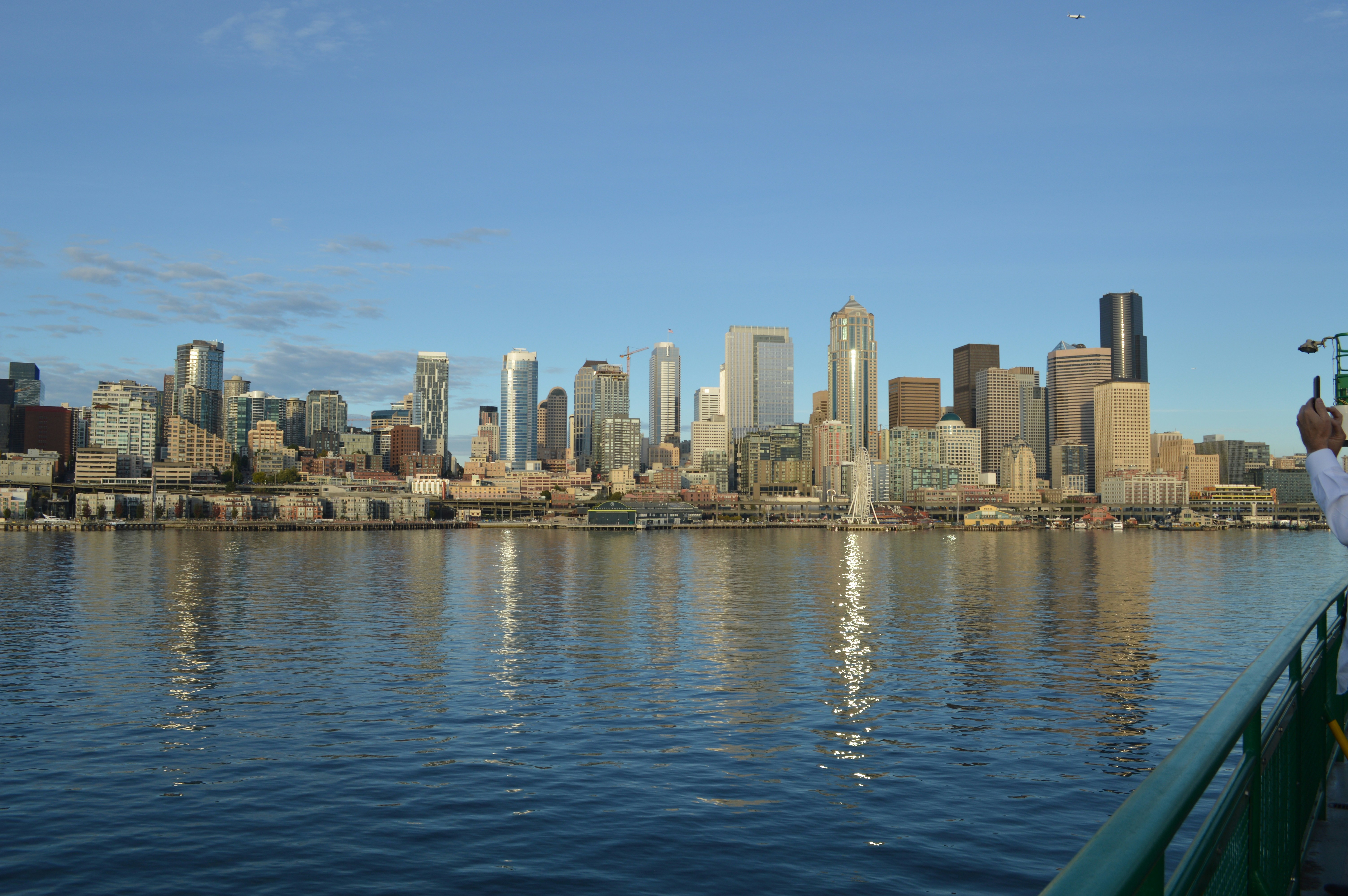 a man taking a picture of a city skyline, 