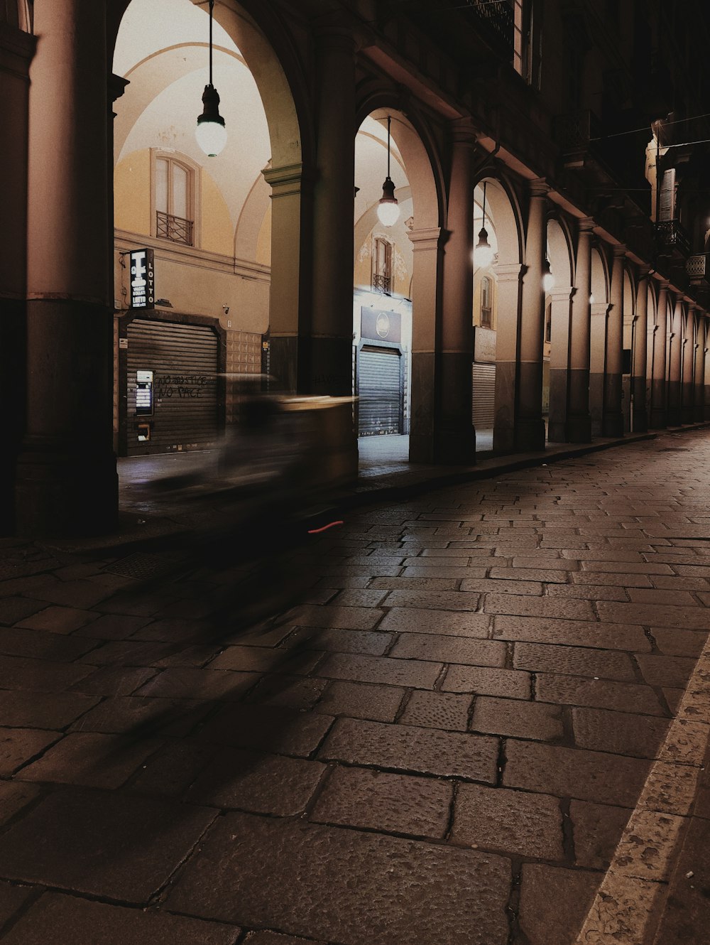 a blurry photo of a car driving down a street