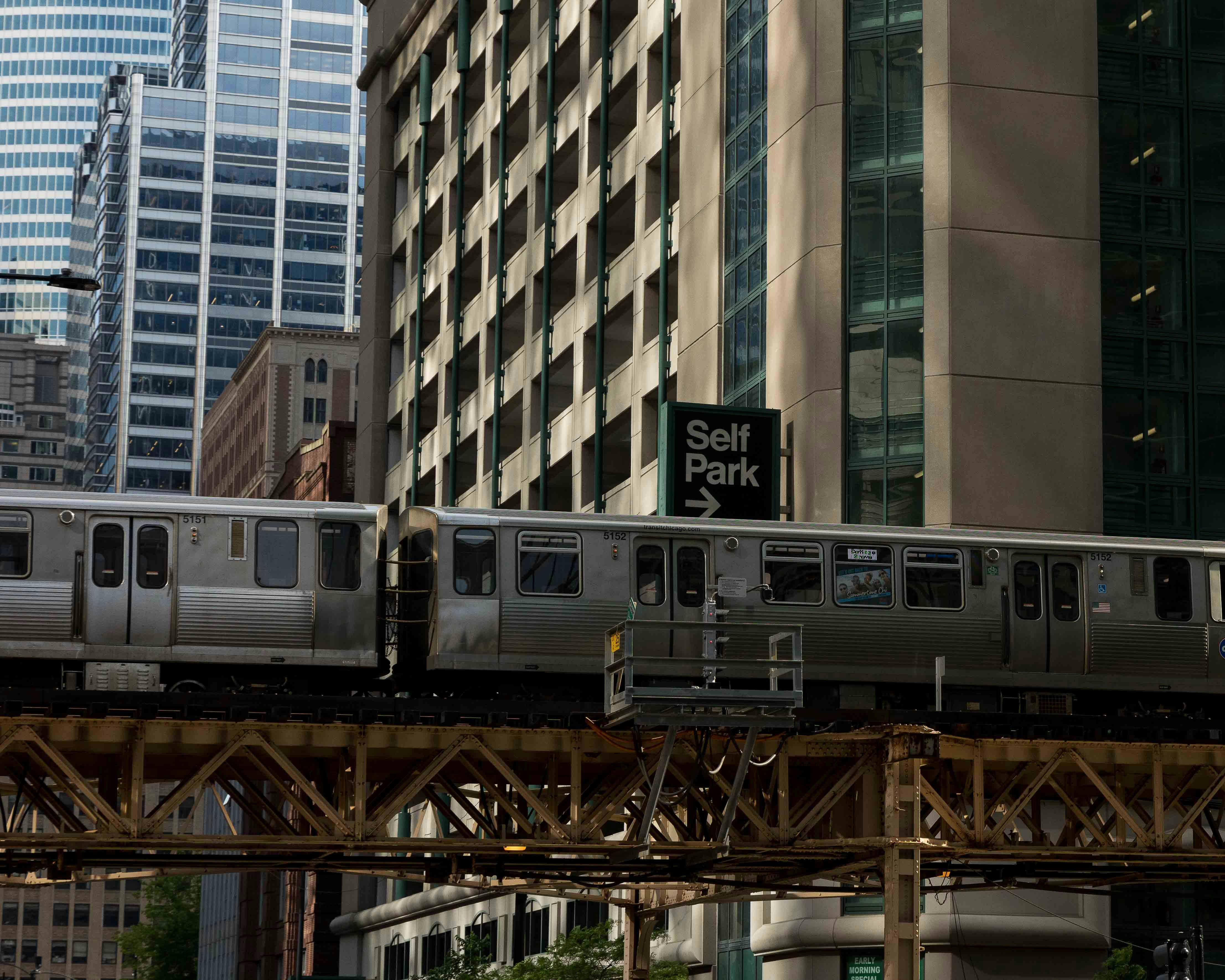 Chicago L train on liftd tracks - 1 bedroom apartments Loop