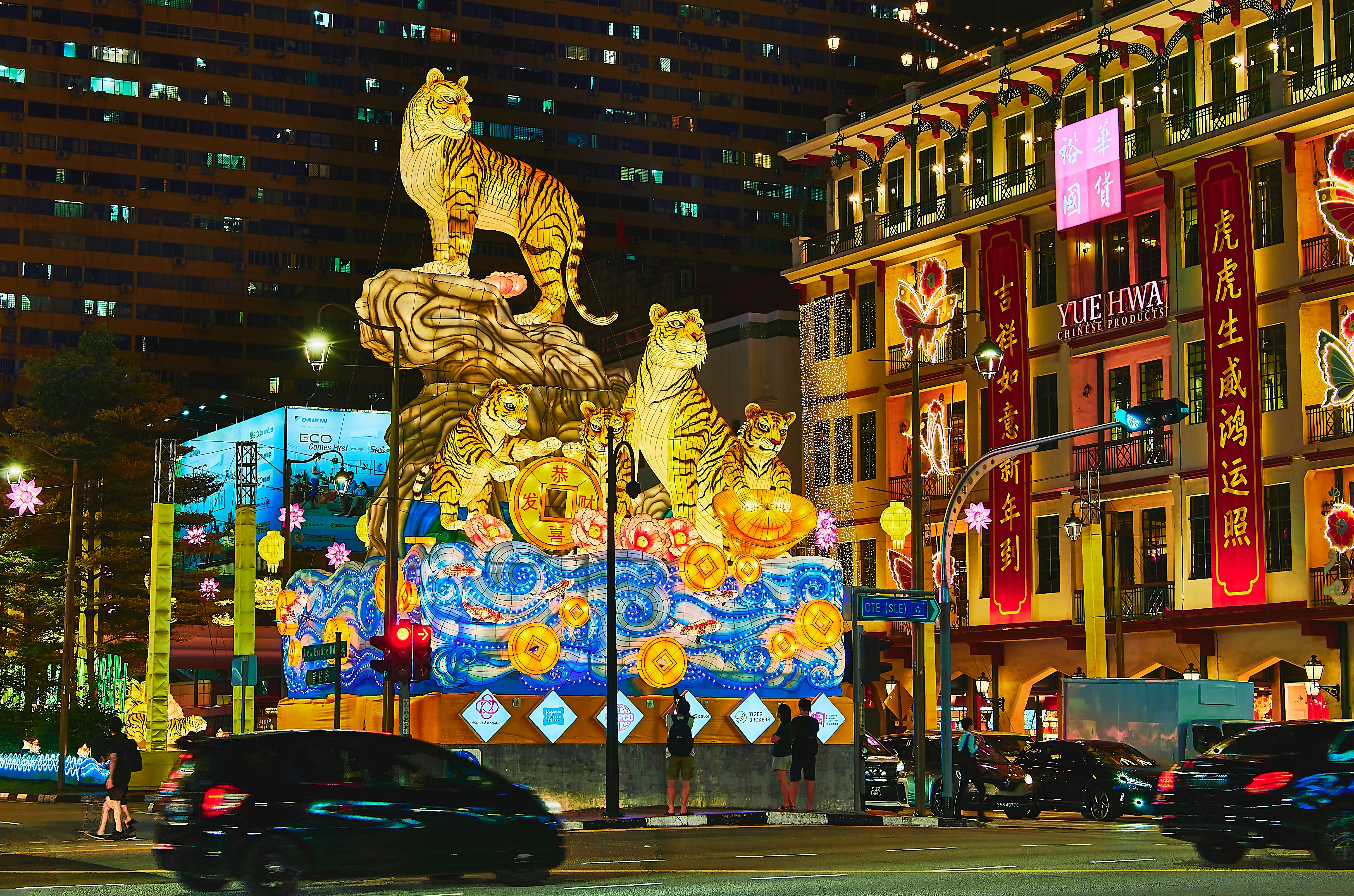 a night scene of a brightly lit city street