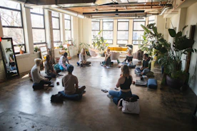 a group of people sitting in a circle in a room