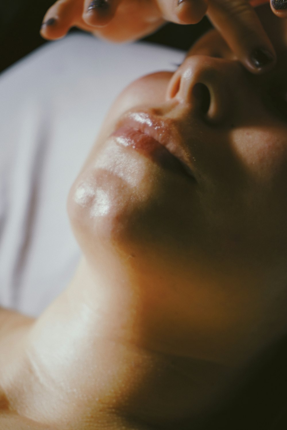 a woman getting a facial massage on her face