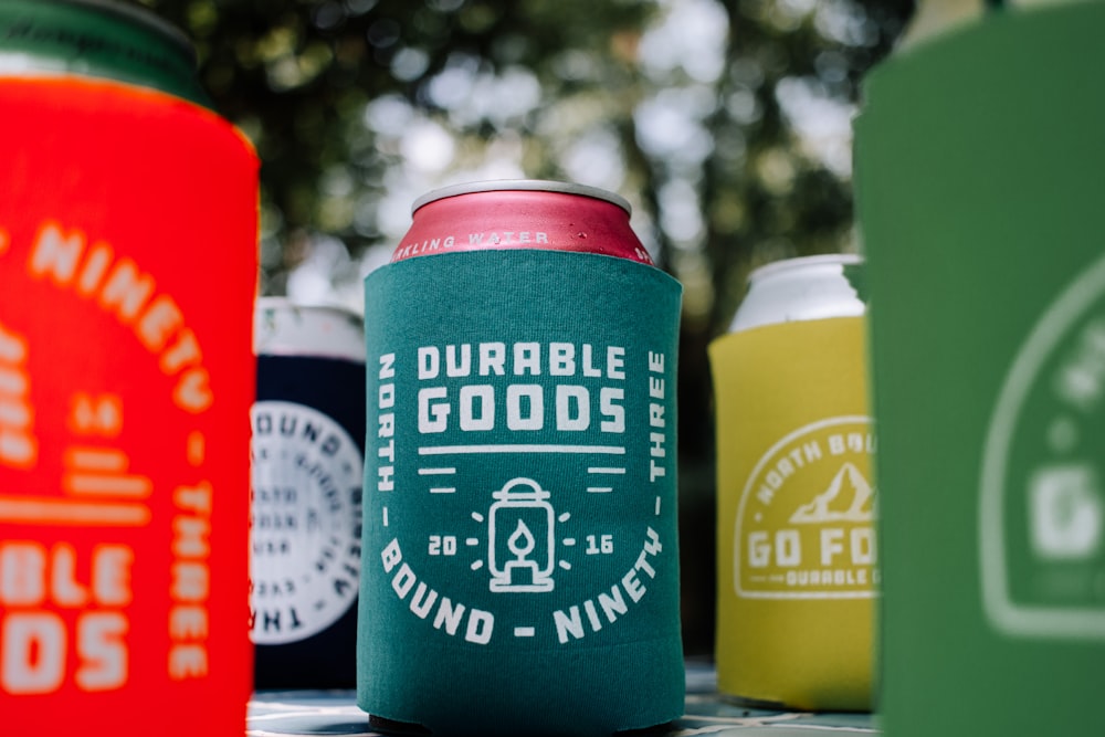 a group of can coolers sitting on top of a table