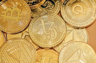 a pile of gold bitcoins sitting on top of each other