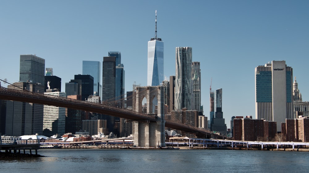 a view of a city skyline with a bridge in the foreground