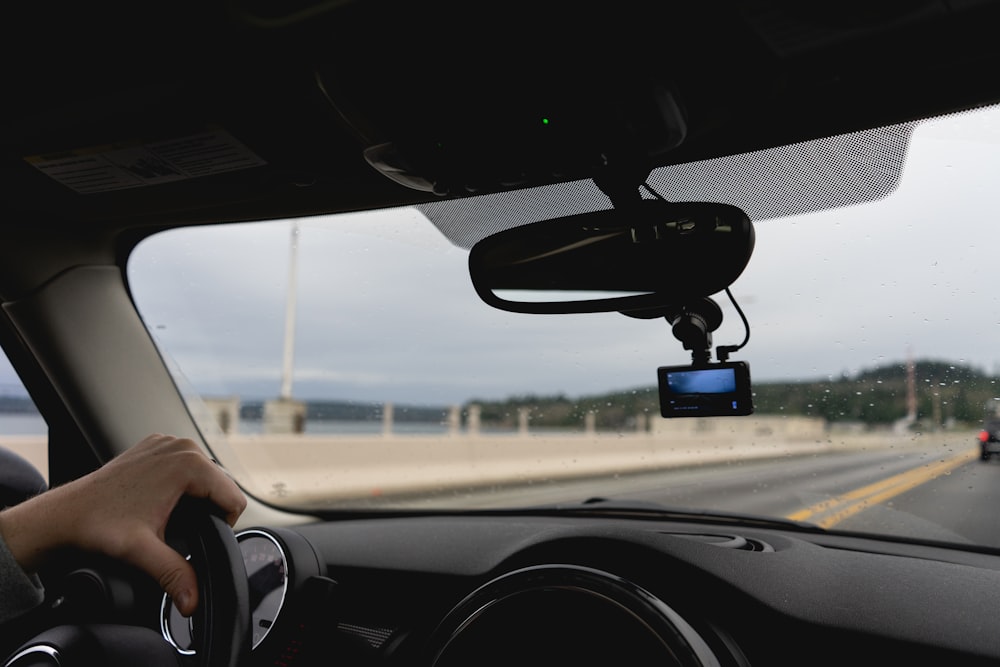 a person driving a car on a highway