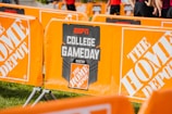 a group of orange barricades sitting on top of a field