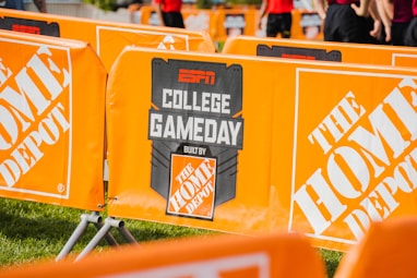a group of orange barricades sitting on top of a field