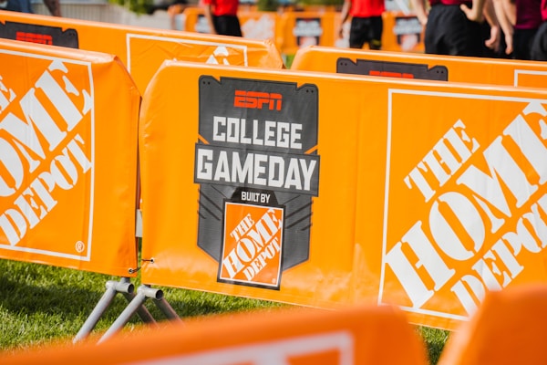 a group of orange barricades sitting on top of a field
