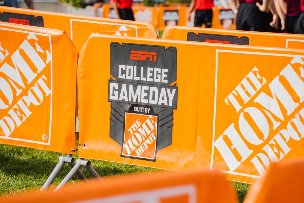 a group of orange barricades sitting on top of a field