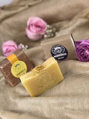 A close-up of a luxurious soap bar with floral accents.