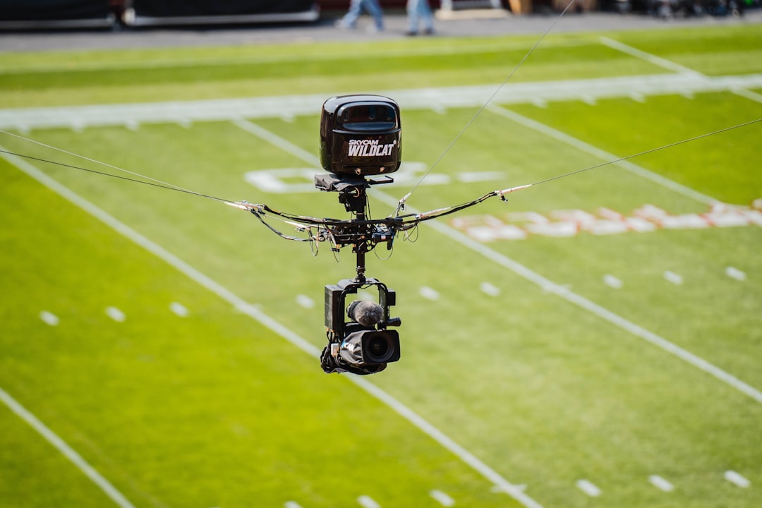 a camera is attached to a football field, Elevated sports camera at Jack Trice Stadium, Iowa State University.