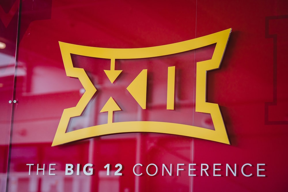 the big 12 conference logo is displayed on a glass wall