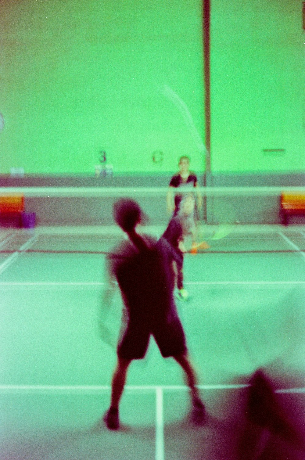 a blurry photo of two people playing tennis