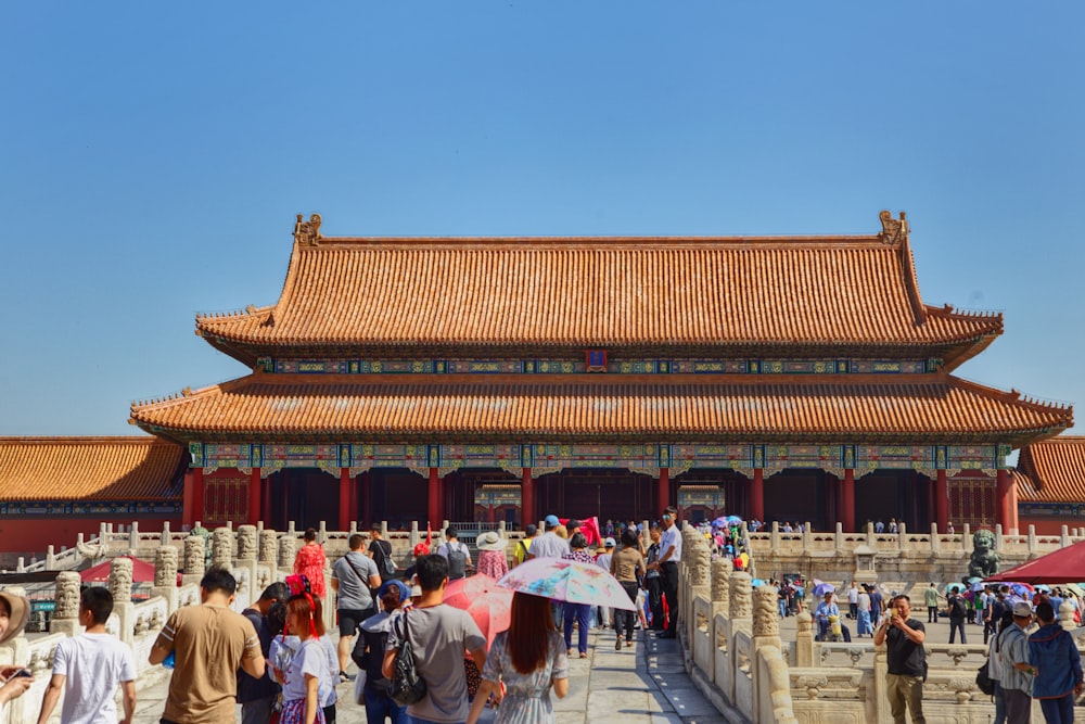 a group of people walking in front of a building