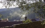 A scenic view of the brick kiln with smoke gently rising.