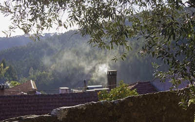 A scenic view of the brick kiln with smoke gently rising.