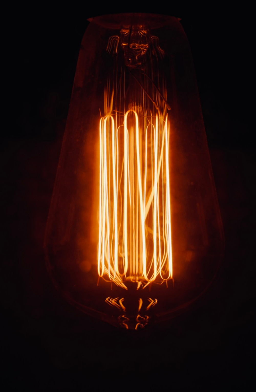 a light bulb that is lit up in the dark