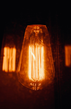 a light bulb that is glowing in the dark