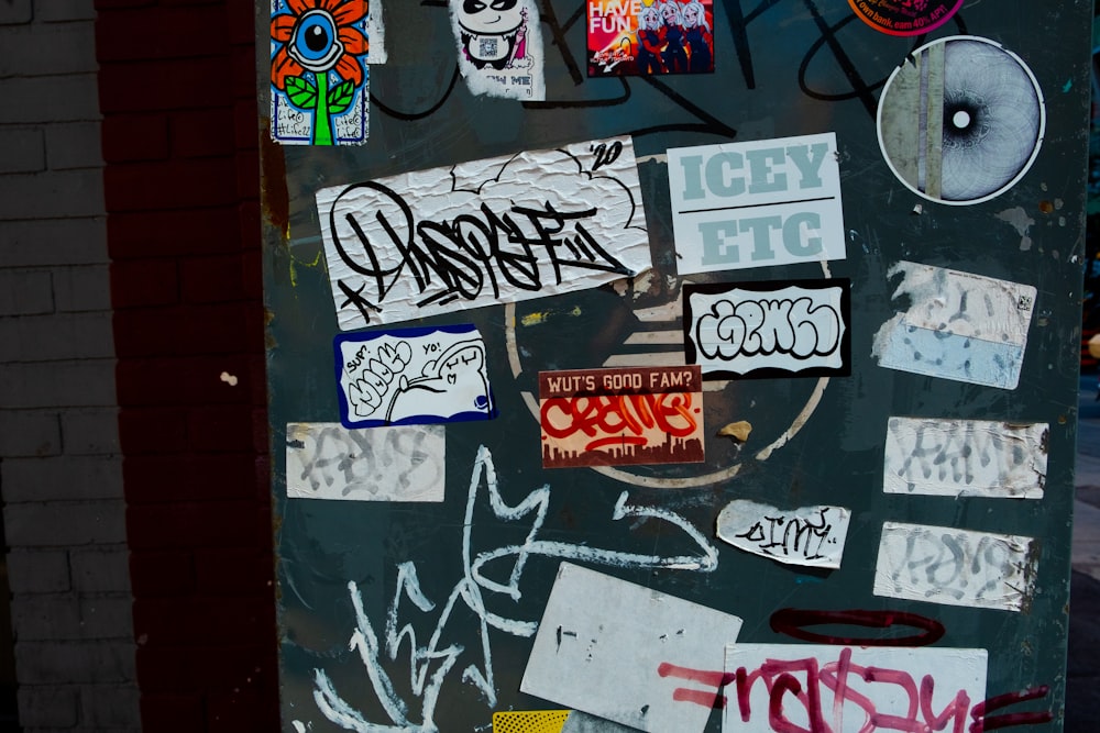 a door covered in graffiti and stickers