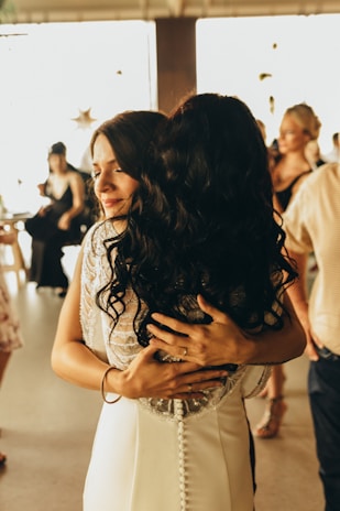a couple of people that are hugging each other