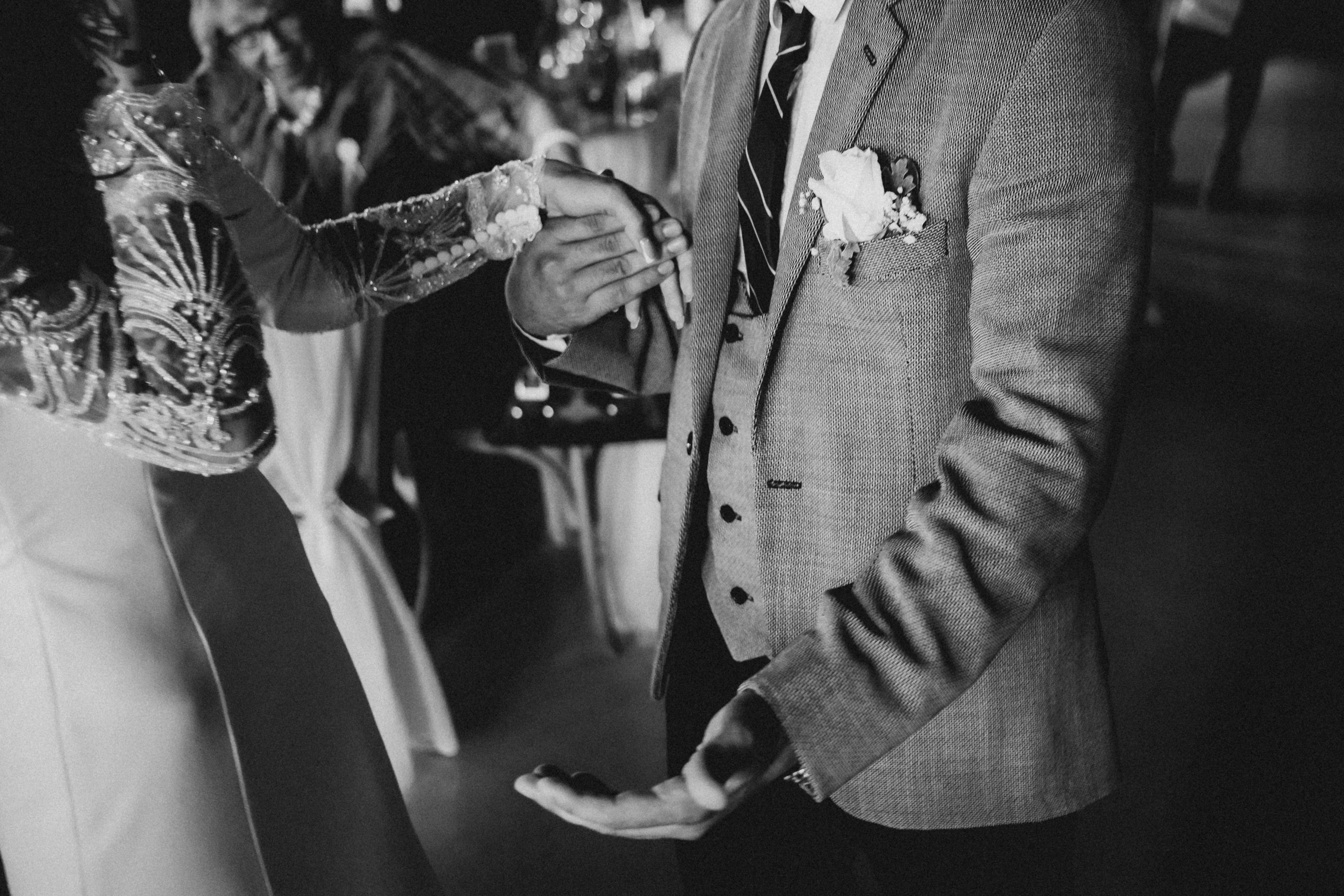 a black and white photo of a bride and groom